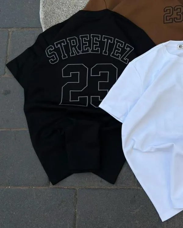 Close-up of the Streetez 23 back print on the black tee