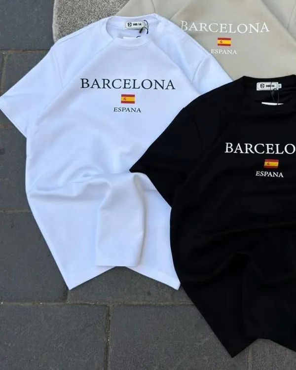 The white and sand Barcelona tees laid flat