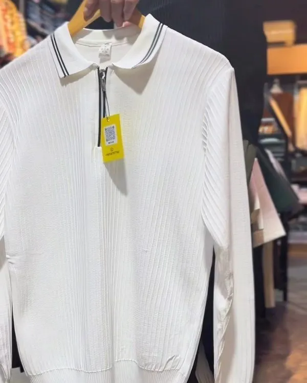 Close-up of the half-zip placket and tipped collar